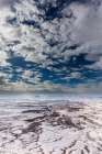 A light snowfall and contrasting orange-colored terrain,e rugged landscape of Canyonlands NP. Art Print